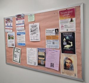 TLIG event poster on a university bulletin board